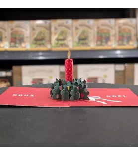 Carte pop-up de Noël Art Grafik avec bougie rouge en relief au centre d'une couronne végétale